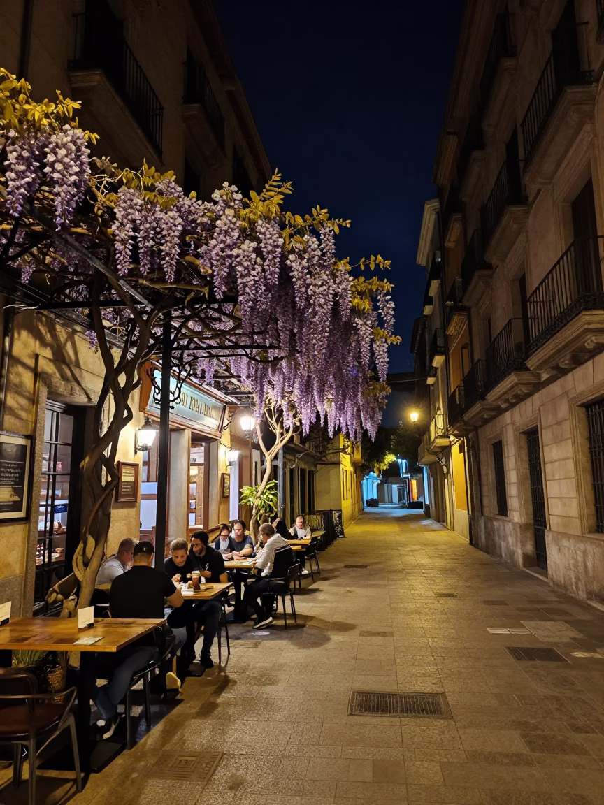 Nighttime Barcelona Street Scene with Wisteria and Local Dining in in Barcelona, Spain
