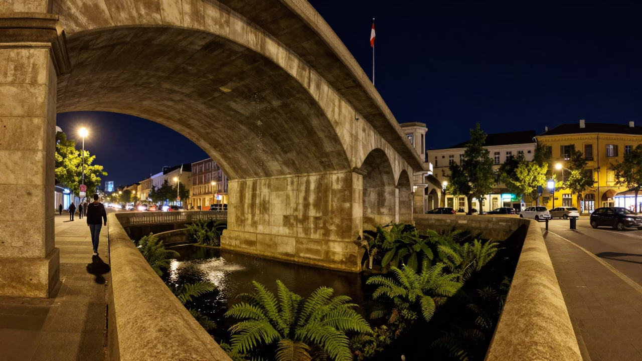 Nighttime Budapest Street Scene with Viaduct Arch and Concrete Retaining Wall in in Budapest, Hungary