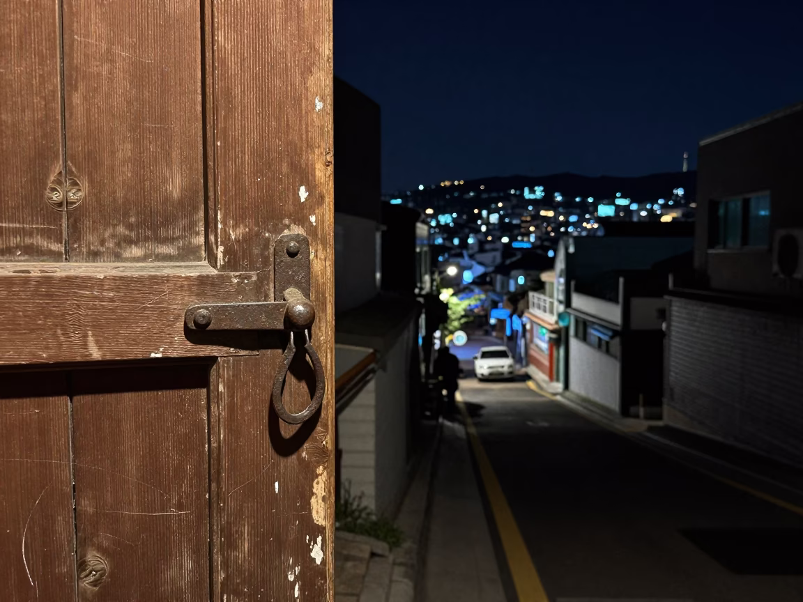 Nighttime Busan Street Scene with Iron Deadbolt and Scratches on Sill Edge in in Busan, South Korea