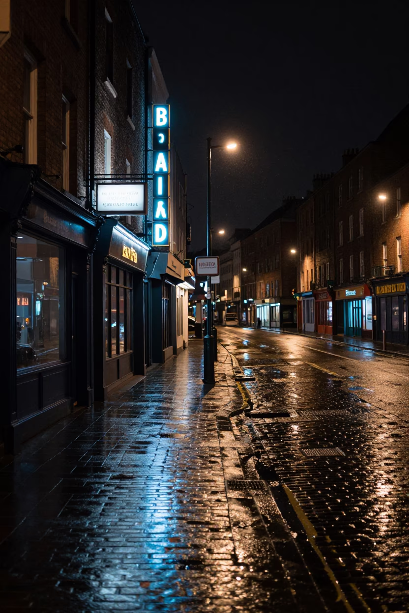 Nighttime Dublin Street Scene with Neon Signs and Wet Pavement Reflections in in Dublin, Ireland
