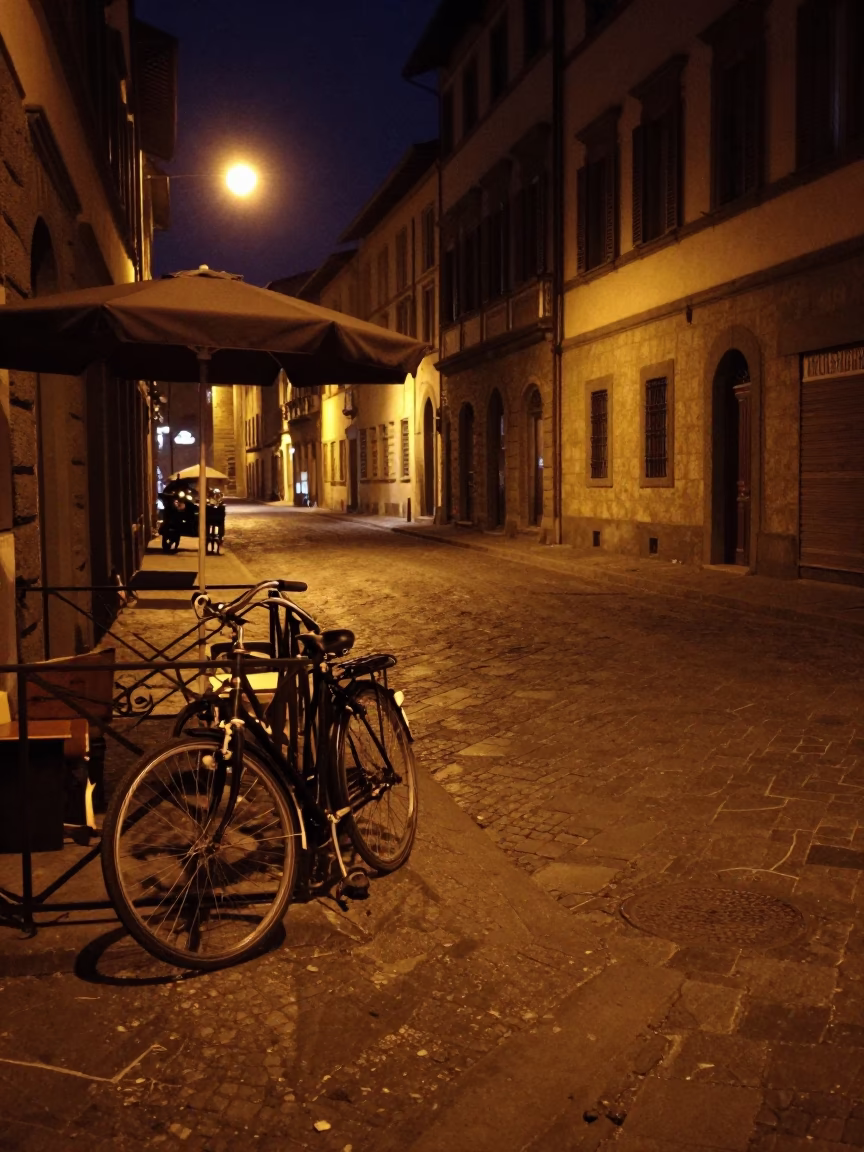 Nighttime Florence Street Scene with Bicycle and Umbrella Stand Under Deep Sky in in Florence, Italy