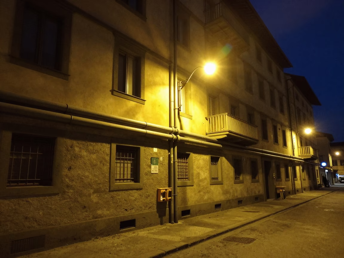 Nighttime Florence Street Scene with District Heating Pipes and Door Handle in in Florence, Italy
