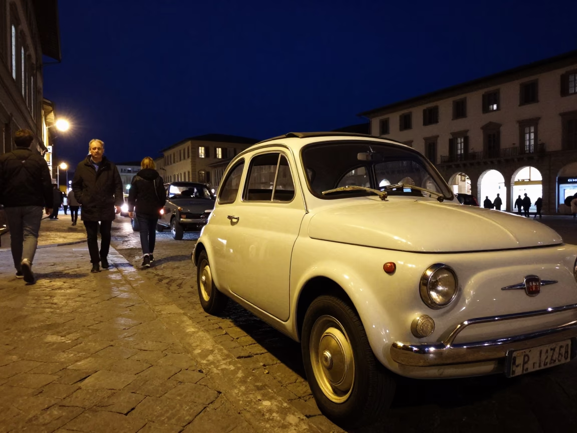 Nighttime Florence street scene with vintage car and pedestrians under deep night sky in in Florence, Italy