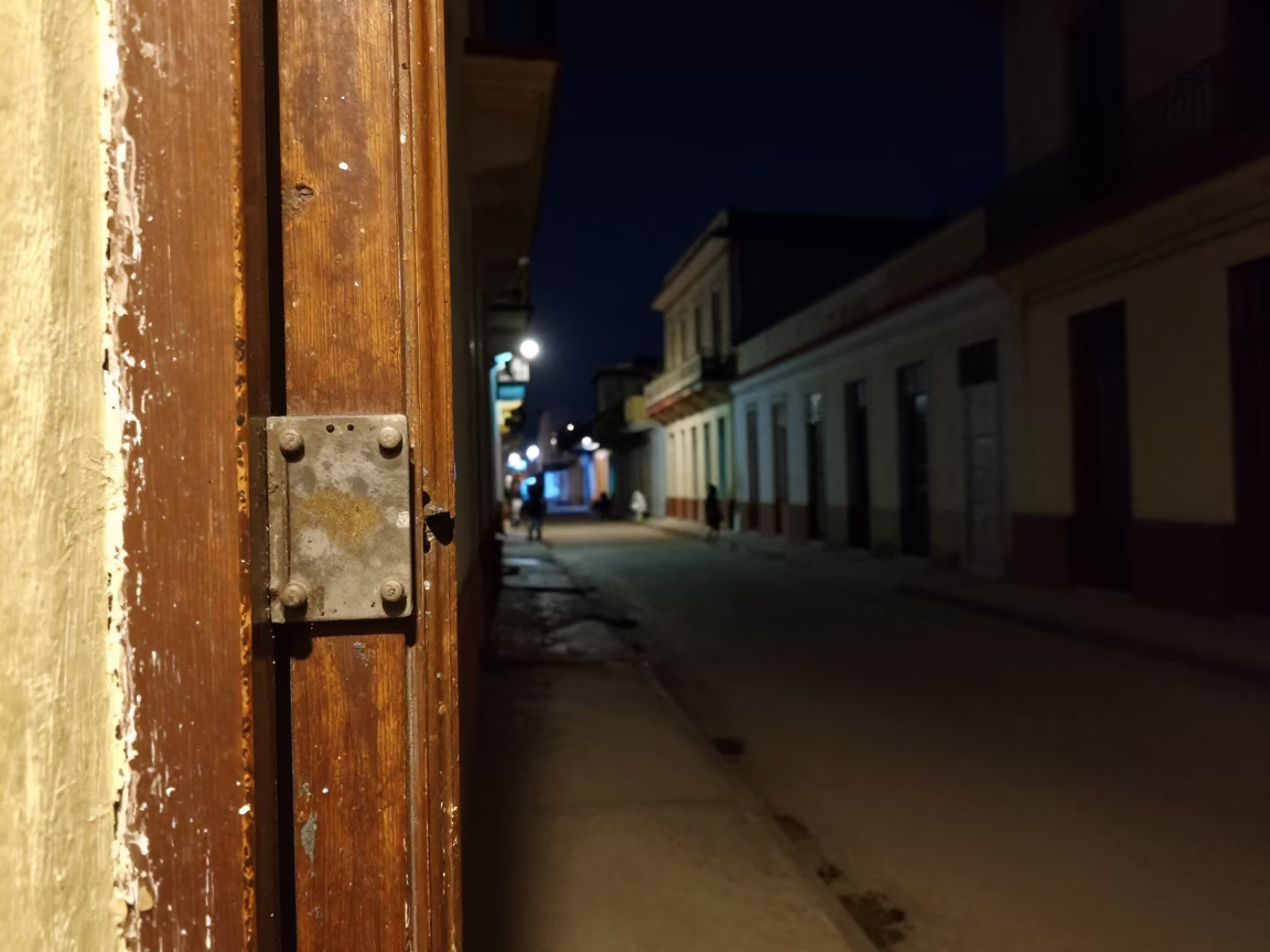 Nighttime Havana Cuba Street Scene with Smudged Latch and Dimly Lit Alleyway in in Havana, Cuba