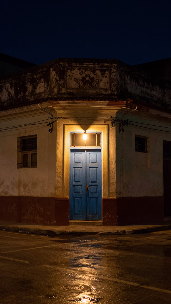 Nighttime Havana Street Corner with Neon Reflections and Local Life in in Havana, Cuba
