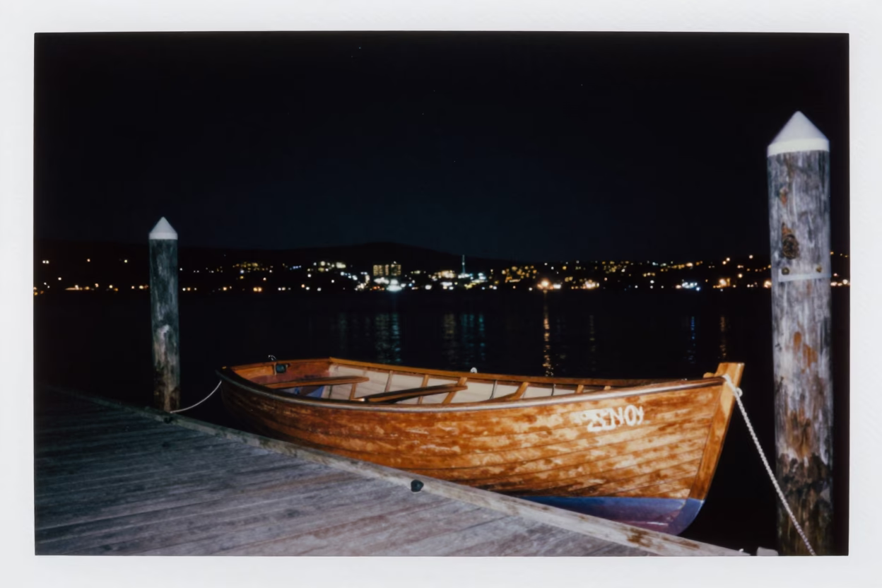 Nighttime Hobart Tasmania Rowboat Docked at Wharf Under Deep Starry Sky in in Hobart, Tasmania, Australia