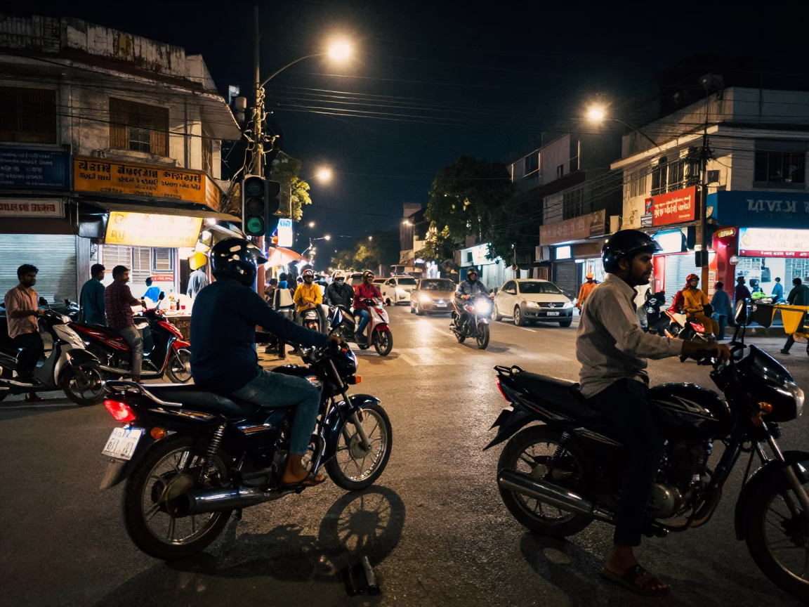 Nighttime Hyderabad Street Scene with Motorbike and Street Vendor Illuminated by Neon Lights in in Hyderabad, India