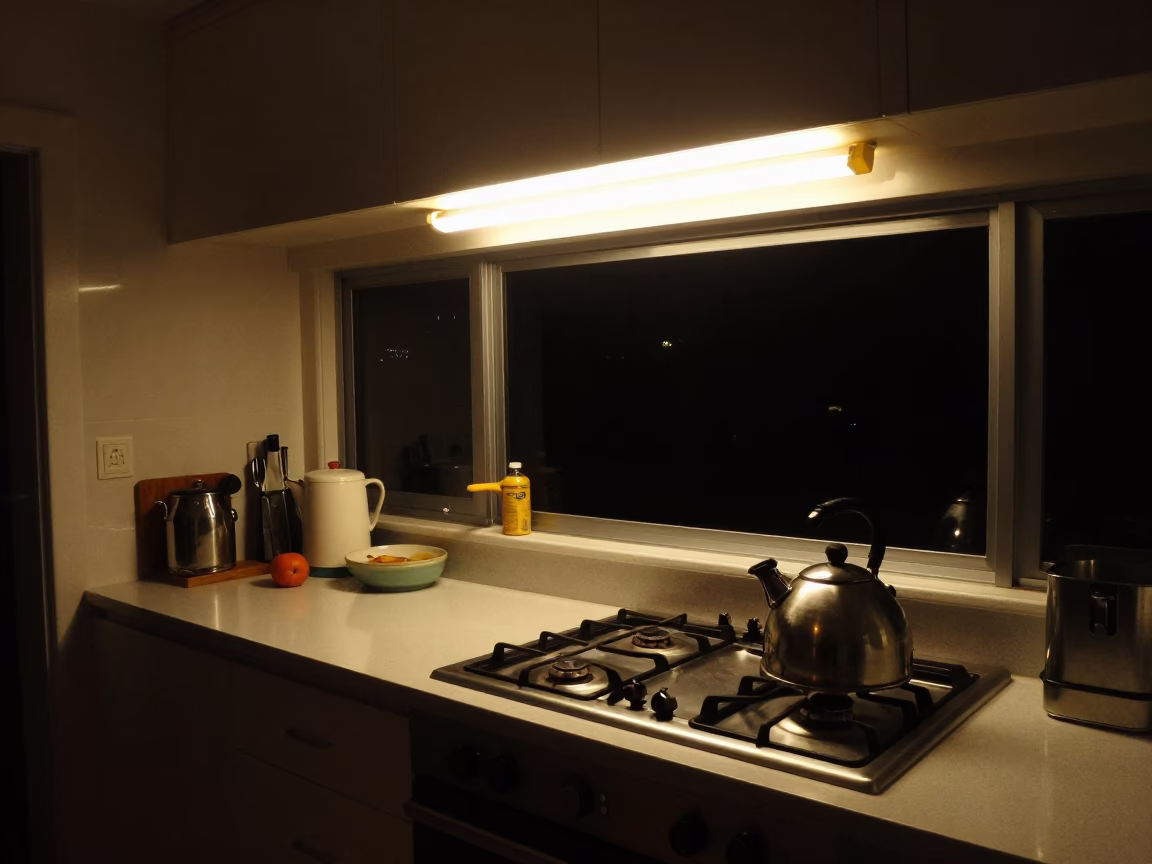 Nighttime Interior of a Busy Hobart Tasmanian Kitchen with Stovetop Kettle and Cup in in Hobart, Tasmania, Australia