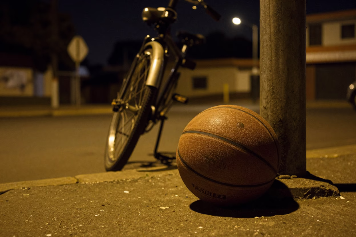 Nighttime Johannesburg Street Scene with Leather Basketball and Bicycle in Urban Neighborhood in in Johannesburg, South Africa