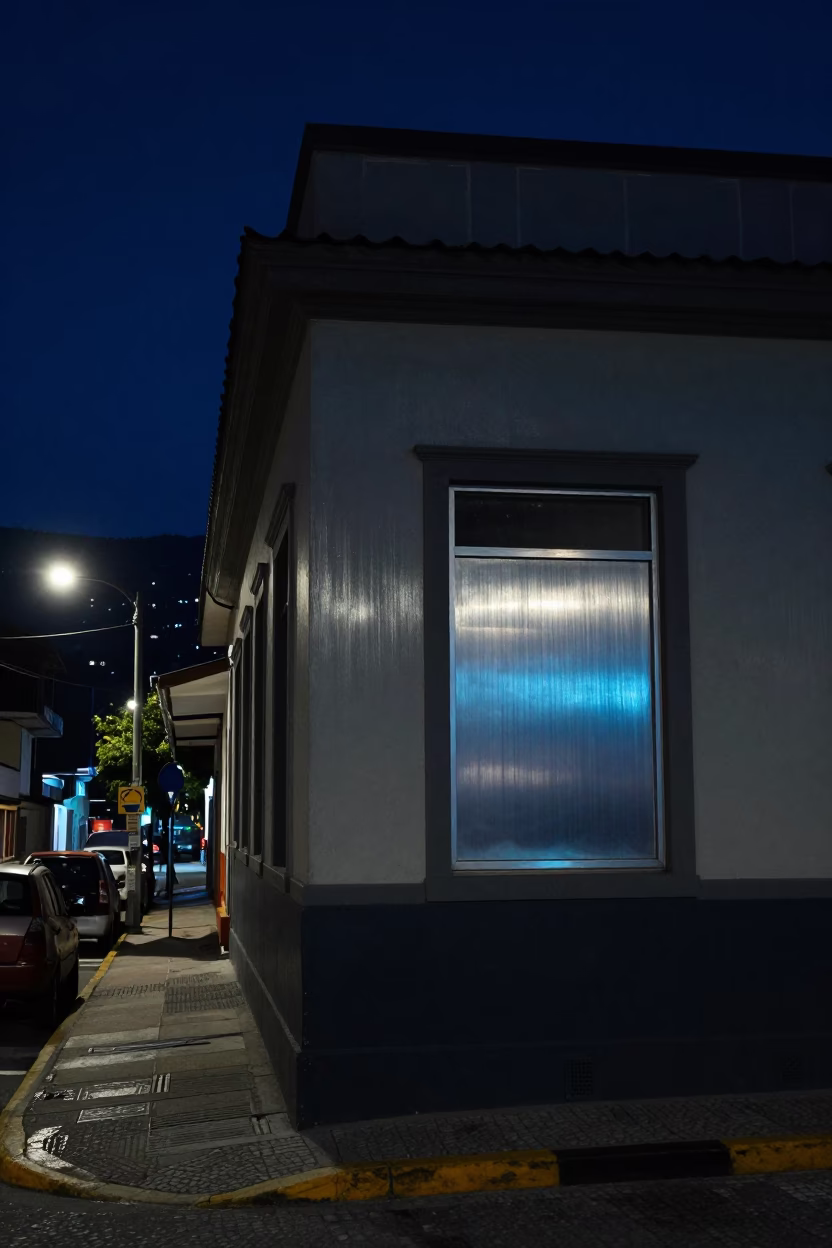 Nighttime Medellín Street Scene with Brushed Steel Window Glass and Urban Architecture in in Medellin, Colombia