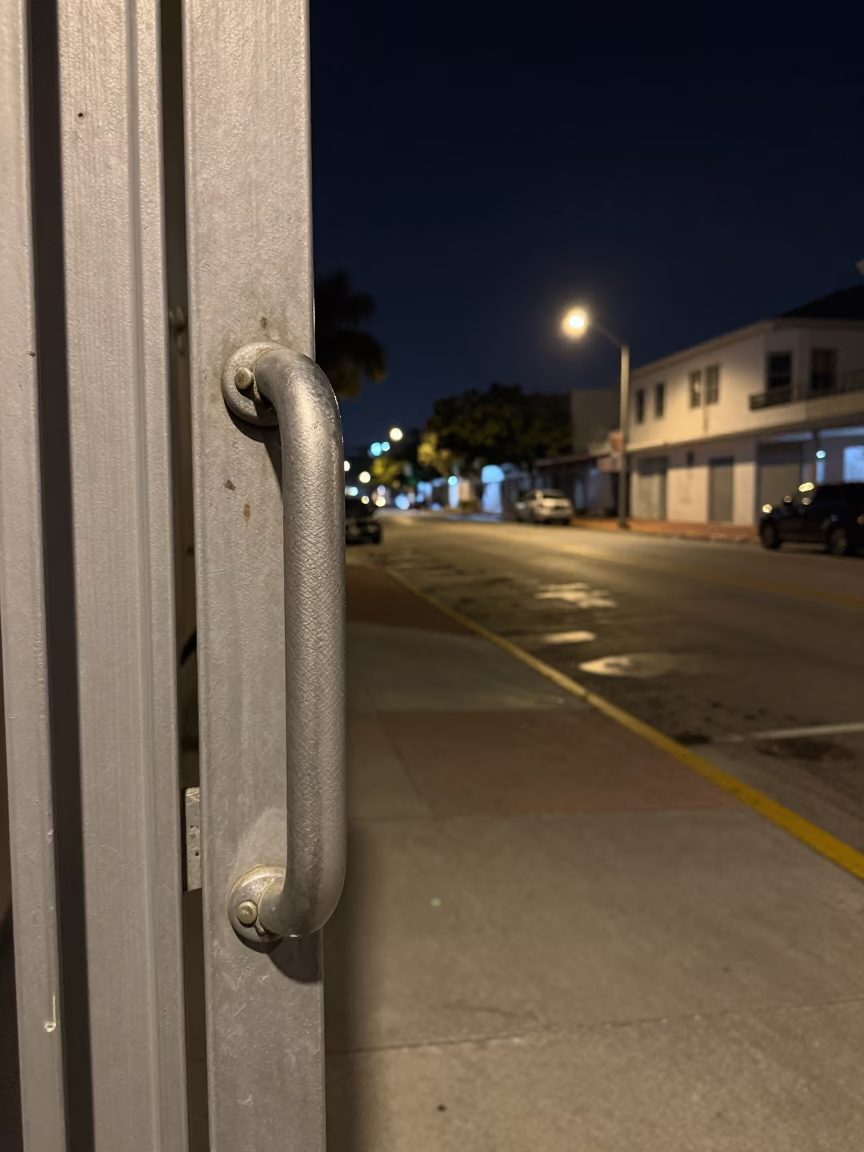 Nighttime Miami Street Scene with Gate Handle and Urban Architecture in in Miami, Florida, United States