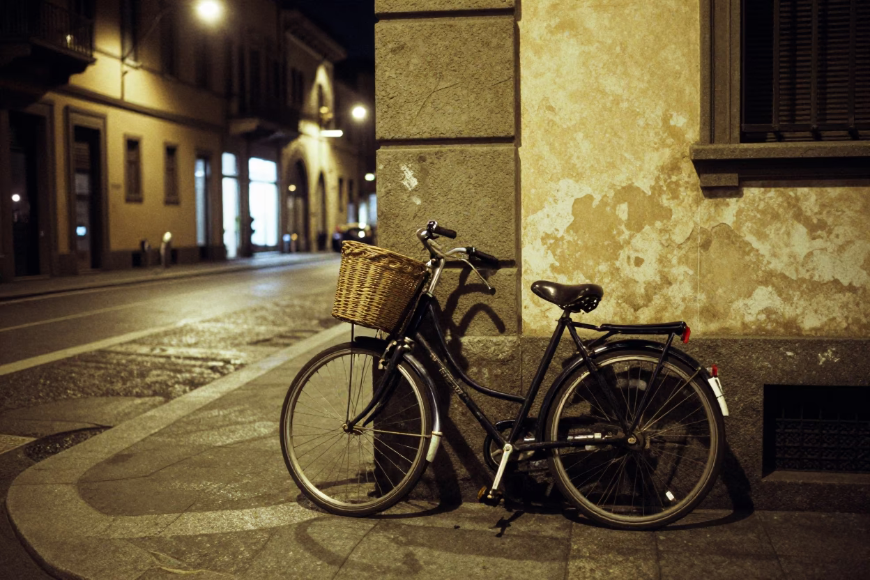 Nighttime Milan Street Scene with Vintage Bicycle and Illuminated Architecture in in Milan, Italy