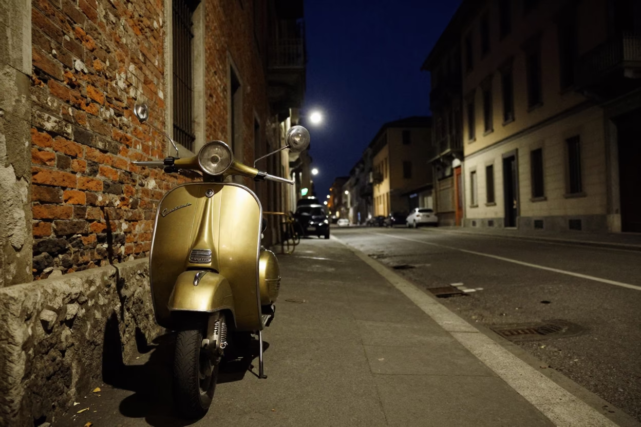 Nighttime Milan Street Scene with Vintage Scooter and Brass Drain Detail in in Milan, Italy