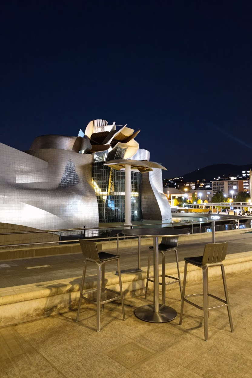 Nighttime Plaza Scene in Bilbao Spain with Bar Stools and Metal Rim in in Bilbao, Spain