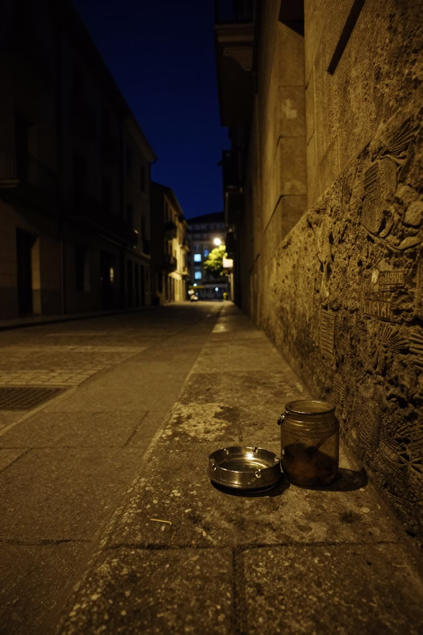 Nighttime Street Corner in Bilbao Spain with Vintage Ashtray and Jar on Stone Ledge in in Bilbao, Spain