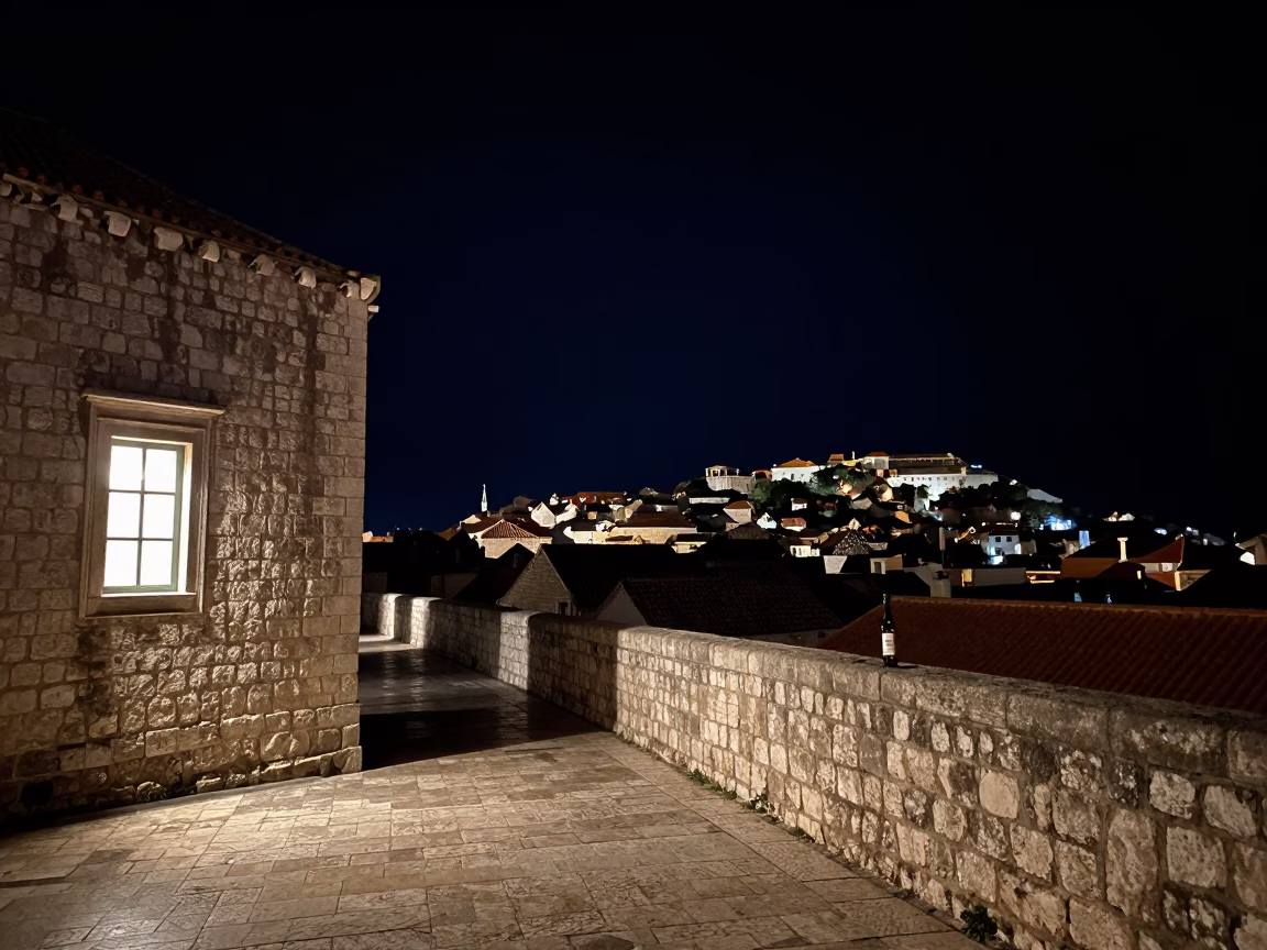 Nighttime Street Scene in Dubrovnik Croatia with Window Light and Bottle in in Dubrovnik, Croatia