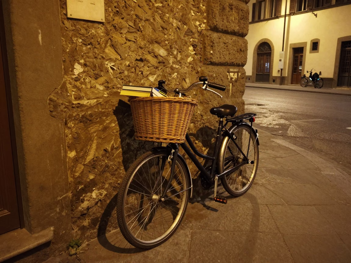 Nighttime Street Scene in Florence Italy with Bicycle Basket and Books in in Florence, Italy