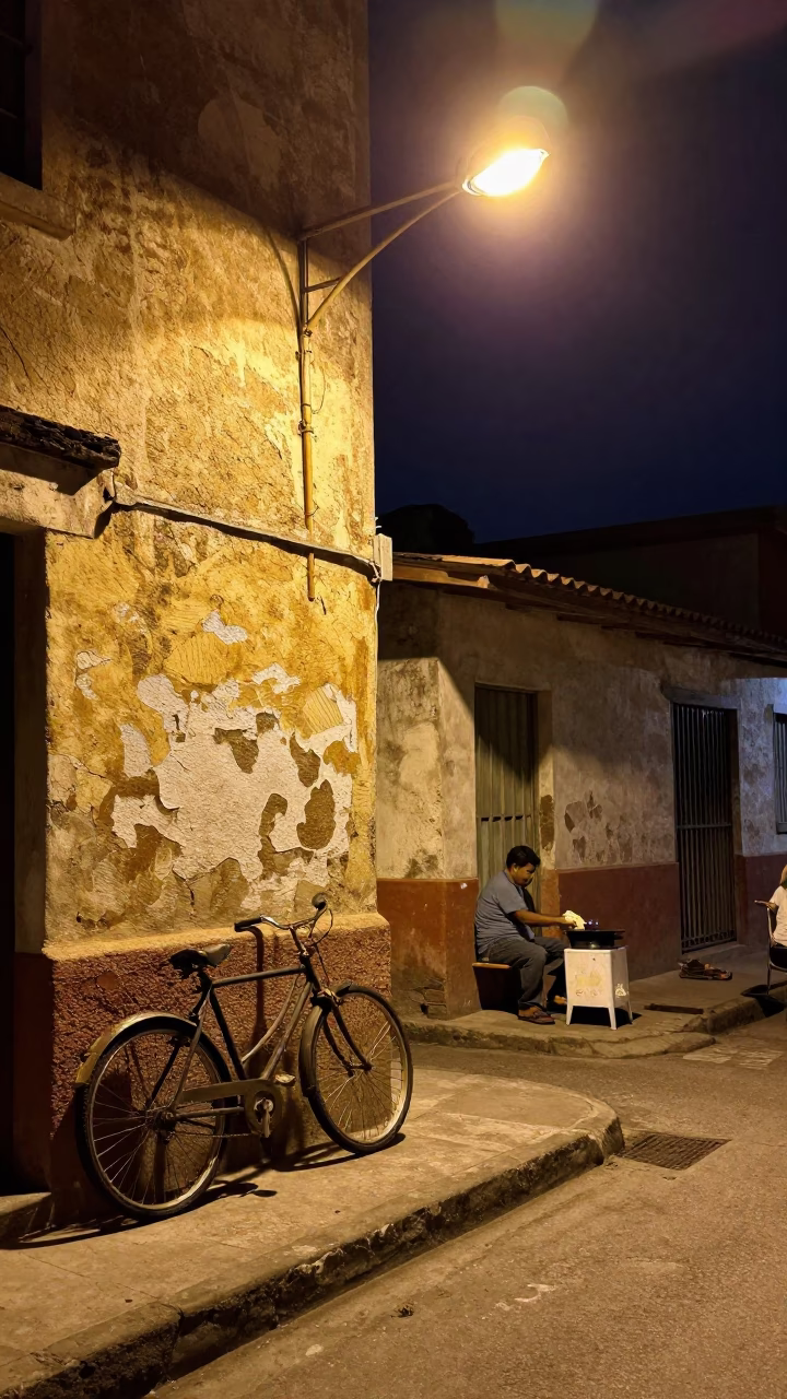 Nighttime Street Scene in Medellin Colombia with Vintage Bicycle and Warm Street Food in in Medellin, Colombia