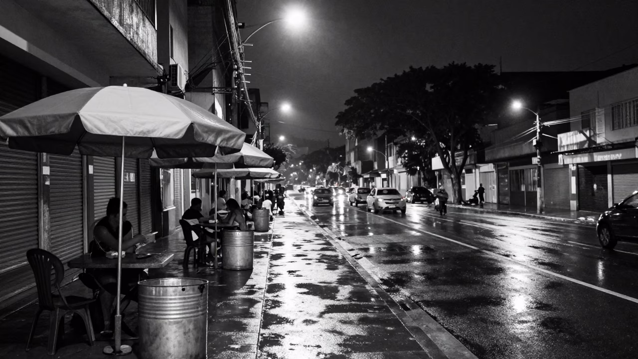 Nighttime Street Scene in São Paulo Brazil with Umbrellas and Metal Bucket in in São Paulo, Brazil