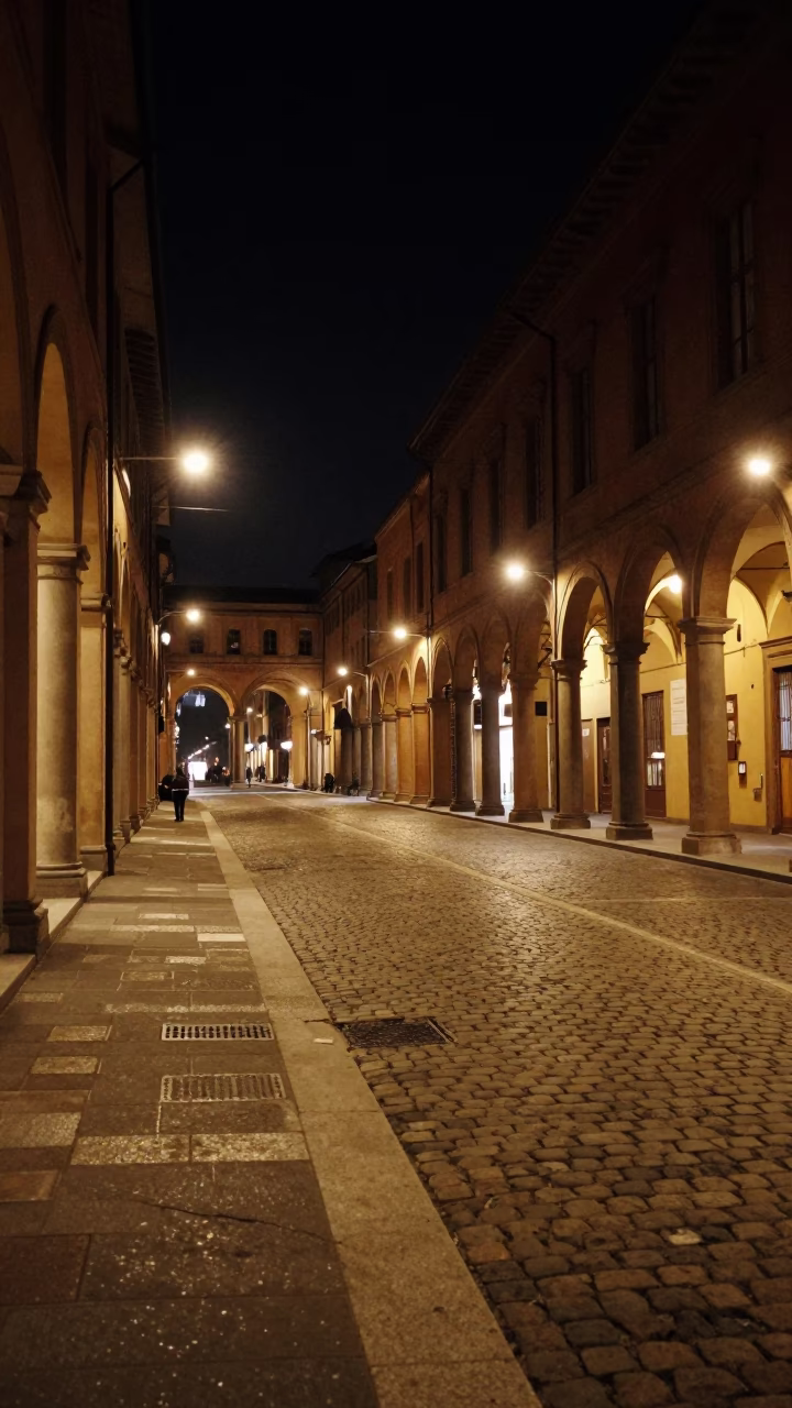 Nighttime Urban Landscape of Bologna Italy with Cobblestone Streets and Illuminated Porticoes in in Bologna, Italy