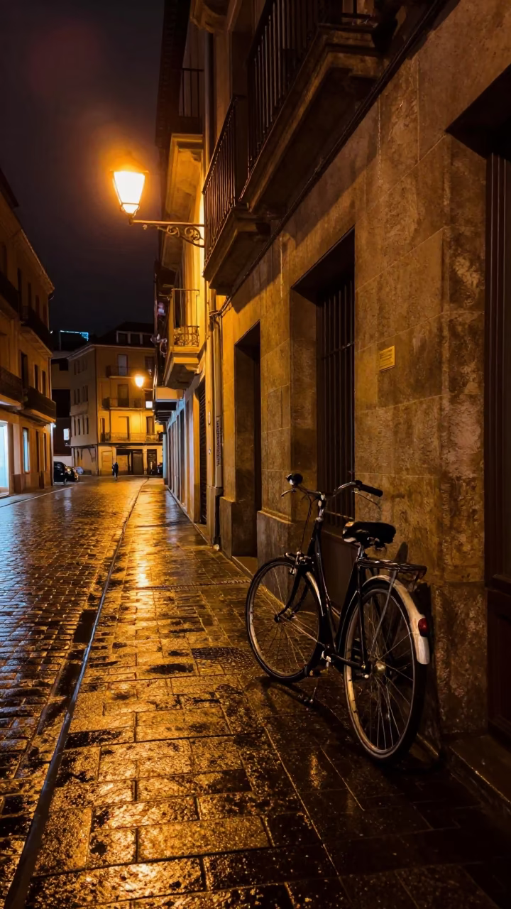 Nighttime Urban Scene in Bilbao Spain with Vintage Bicycle and Street Latch Detail in in Bilbao, Spain