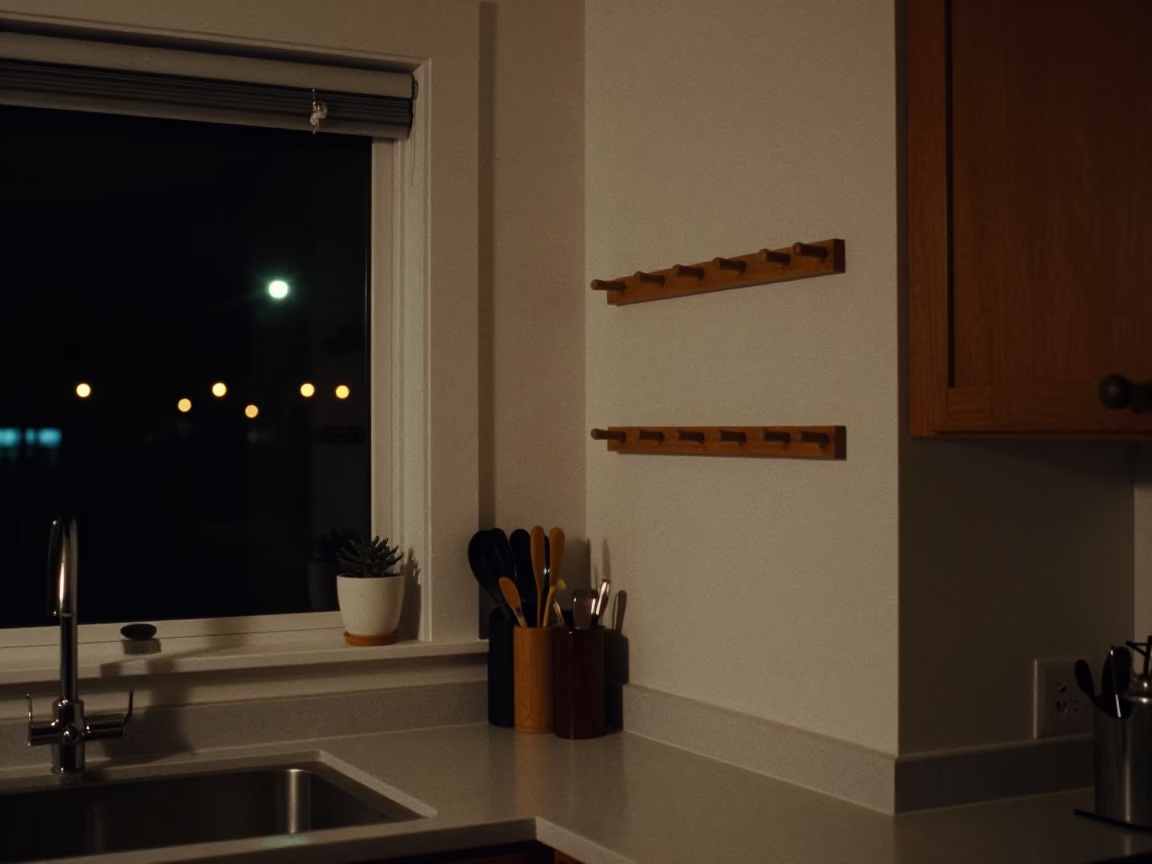 Nighttime Vancouver Kitchen Interior with Peg Rails and Paint Flecks in in Vancouver, British Columbia, Canada