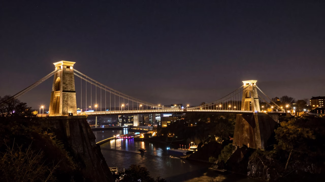 Nighttime View of Clifton Suspension Bridge and Bristol Harbor Under Deep Sky in in Bristol, United Kingdom