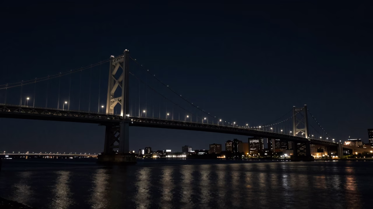 Nighttime View of Philadelphia's Benjamin Franklin Bridge and City Skyline Under Deep Darkness in in Philadelphia, Pennsylvania, United States