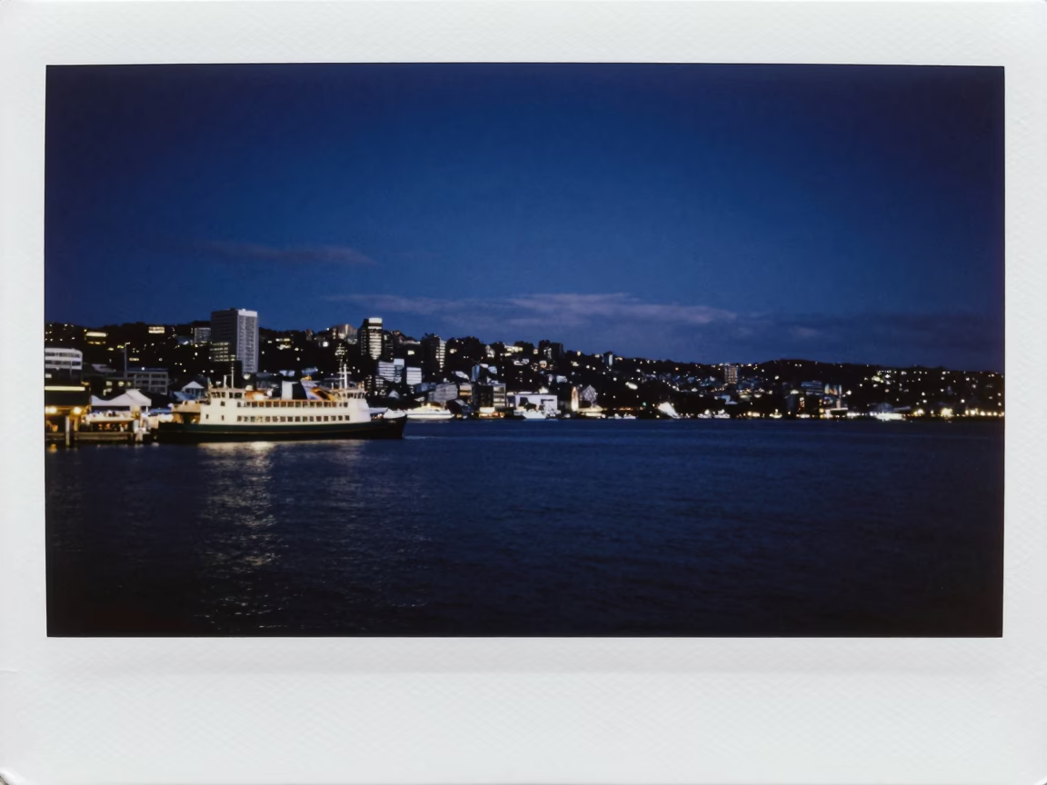 Nighttime Wellington Harbour View with Ferry and Distant City Lights in in Wellington, New Zealand