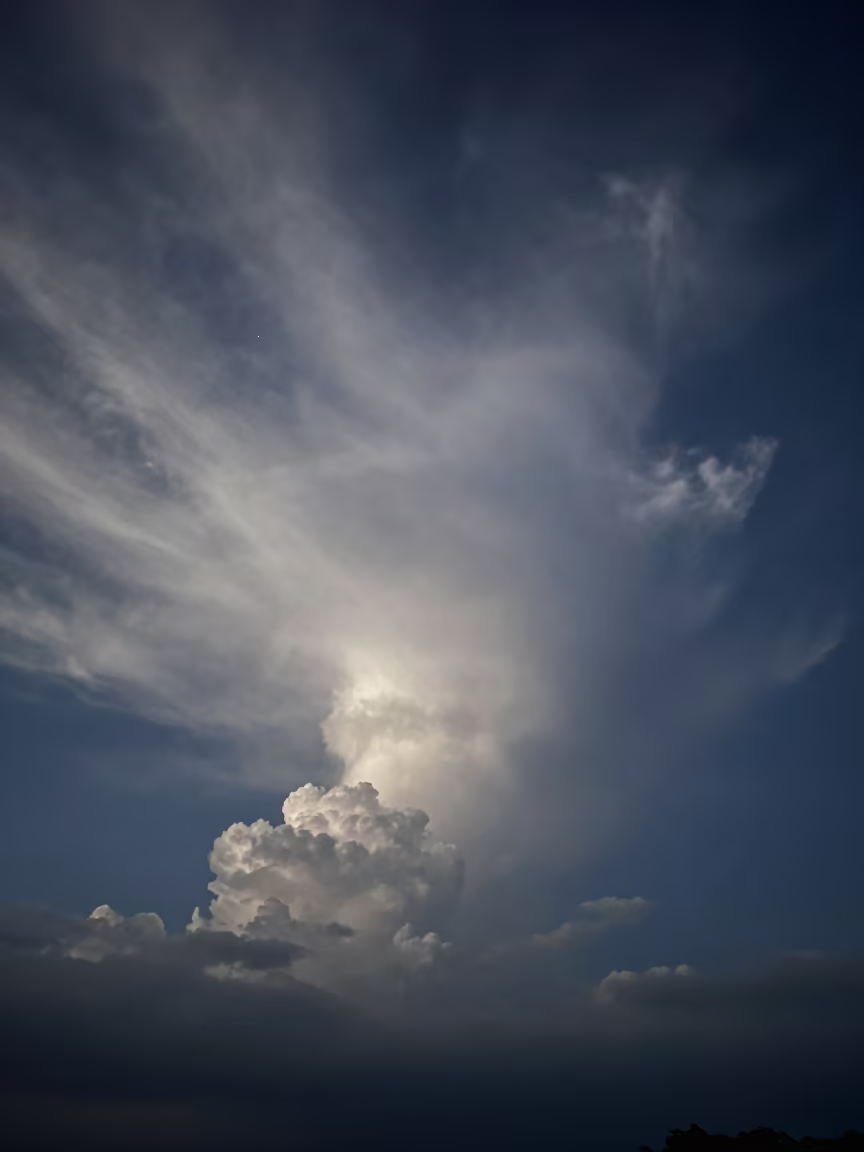 Noctilucent Clouds Over Minas Gerais Thunderheads in over a horizon of stacked thunderheads in Minas Gerais