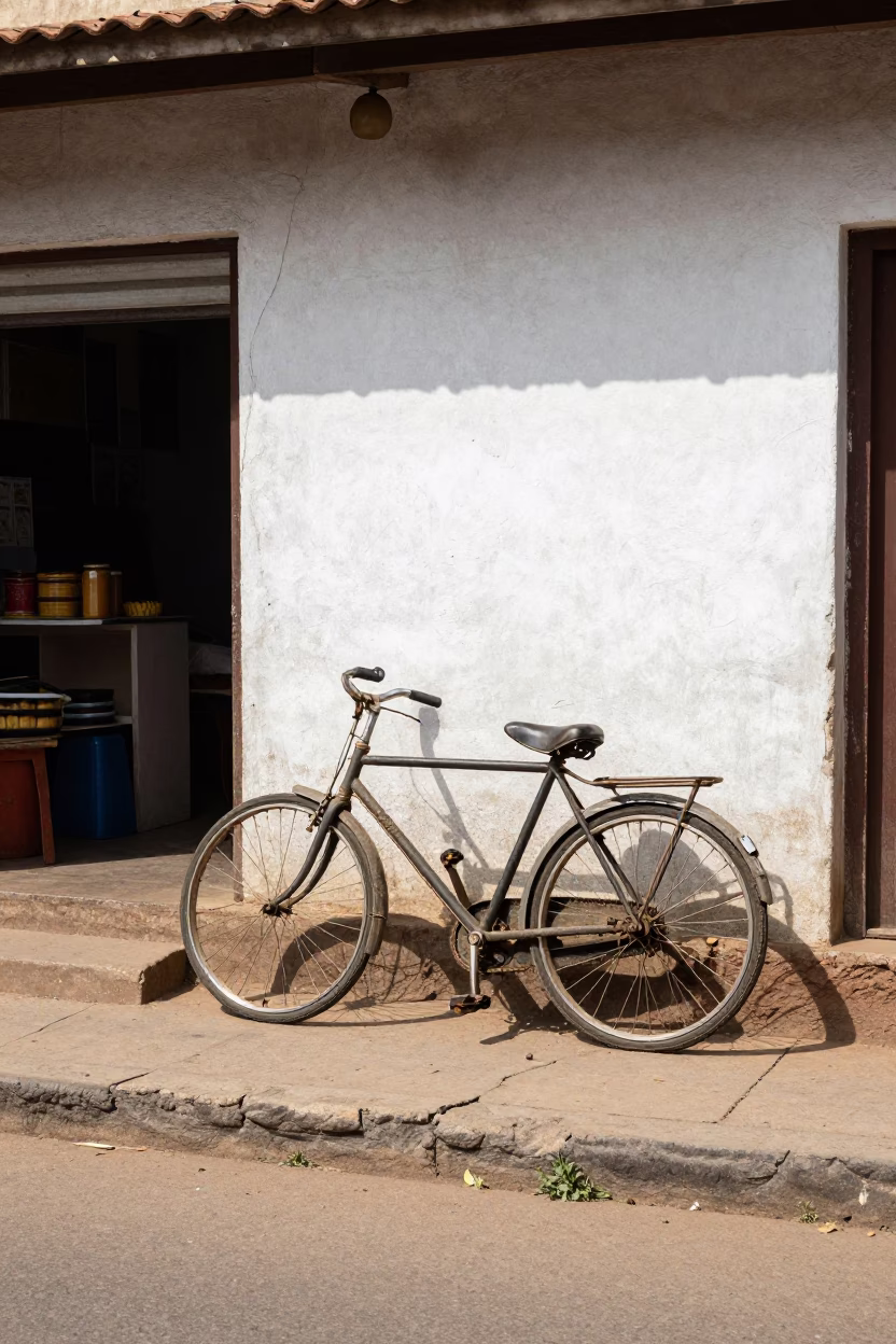 Noon Light on Accra Street with Bicycle Bakery and Date Palm Clusters in in Accra, Ghana