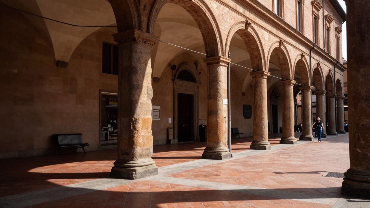 Noon light on Bologna porticoes capturing street life and traditional commerce in in Bologna, Italy