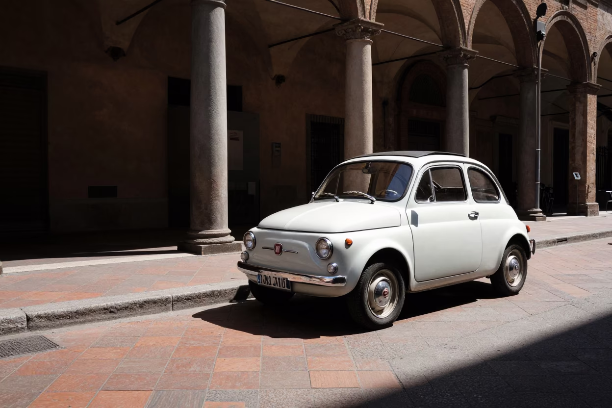 Noon Light on Bologna Street Corner with Vintage Car and Pedestrians in Italy in in Bologna, Italy