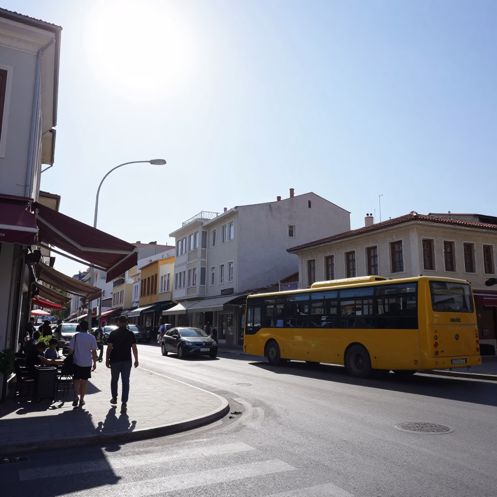 Noon Light on Izmir Street Corner with Yellow Bus and Pedestrians in in Izmir, Turkey