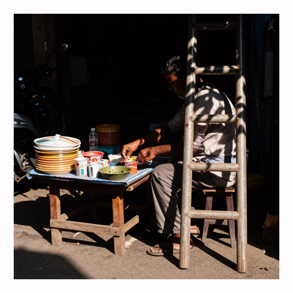 Noon Light on Kolkata Street Vendor with Leaf Shadows and Ladder-Back Chair in in Kolkata, India