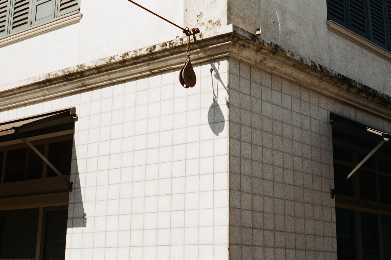 Noon light on Kuala Lumpur street corner with pulley and tile grout details in in Kuala Lumpur, Malaysia