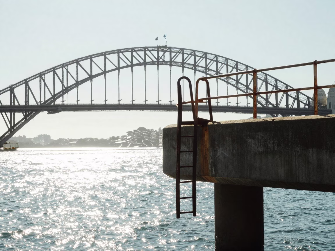 Noon Light on Sydney Harbour Bridge Pier Ladder Above Choppy Estuary Water in in Sydney, New South Wales, Australia