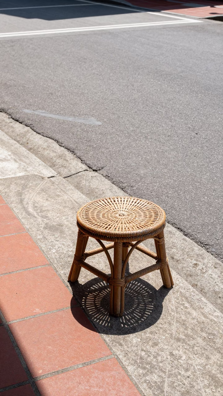 Noon Light on Tainan Street Corner with Rattan Stool and Glass Tumbler in in Tainan, Taiwan
