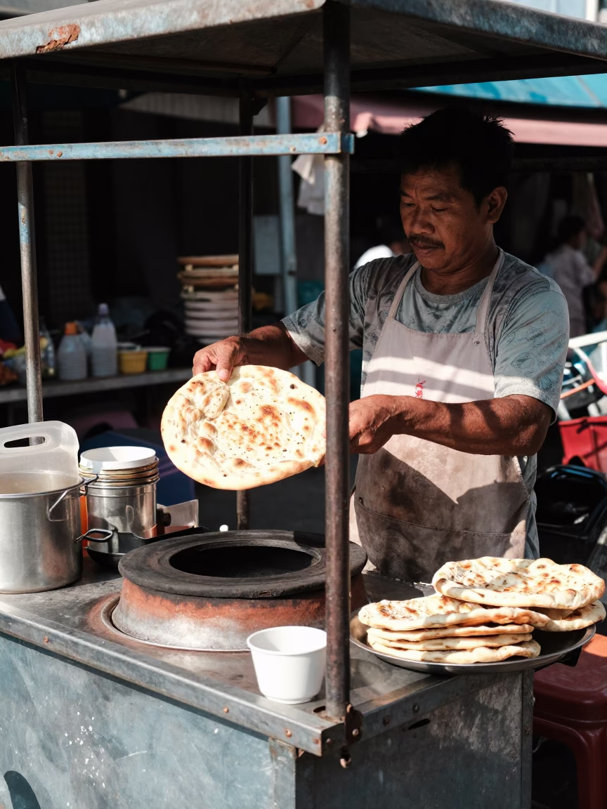 Noon Street Food Vendor in Phuket Thailand Selling Fresh Tandoori Naan Bread in in Phuket, Thailand