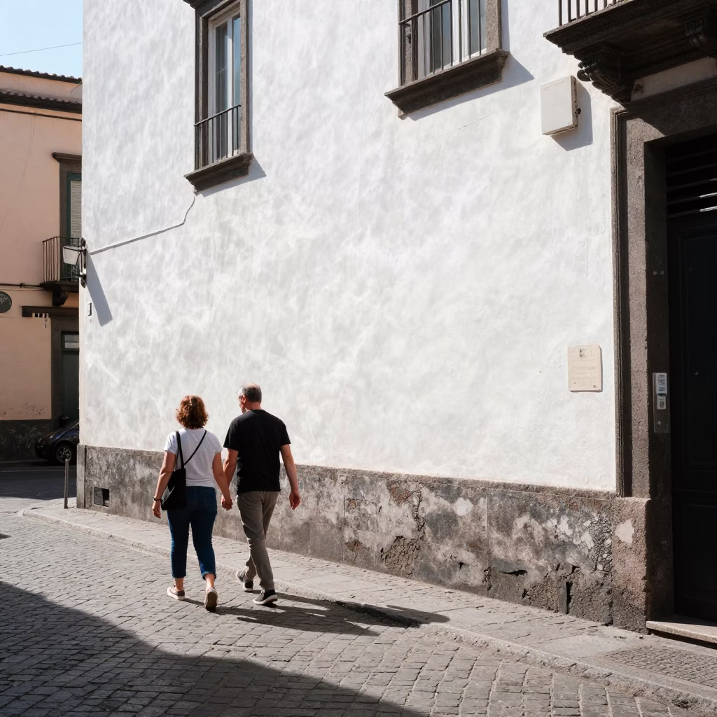 Noon Sunlight on Naples Street with Couple Walking and Pigeons in in Naples, Italy