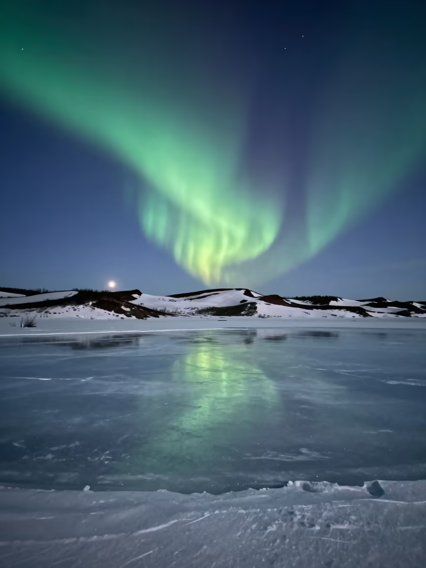 Northern Lights Over Frozen Russian Tundra Night in from a dune-backed overlook in clear desert air in Russia