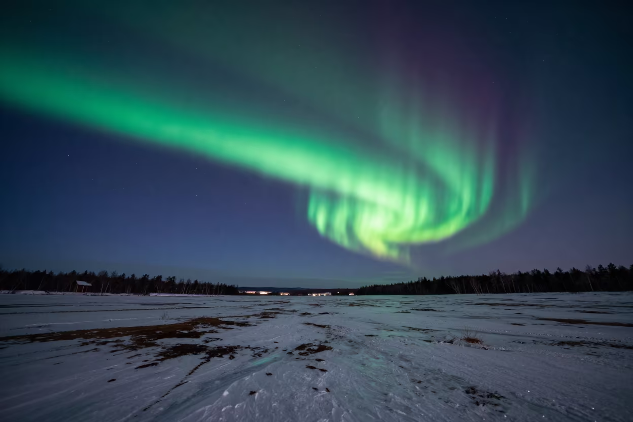 Northern Lights Over Frozen Sapporo Tundra Night in beneath a moon-washed horizon near Sapporo