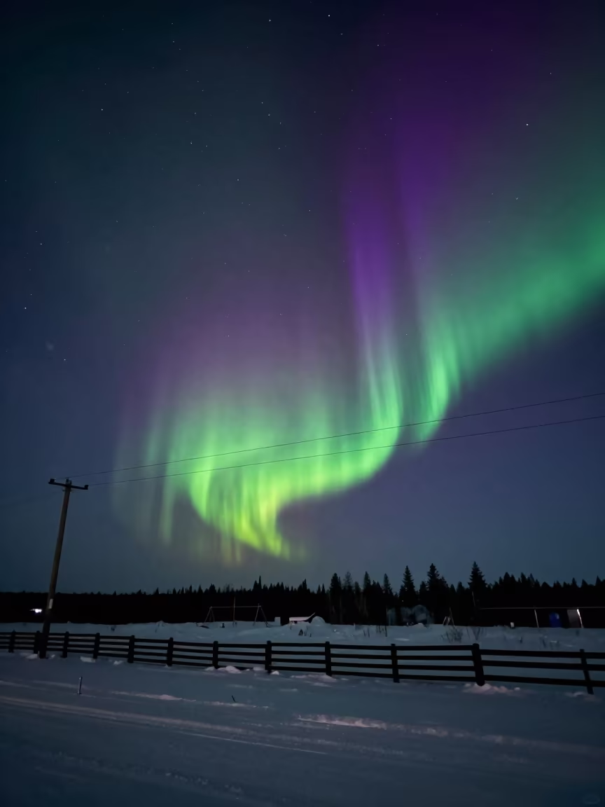 Northern Lights Over Snow Fences at Night in from a frost-hushed ridgeline in Canada