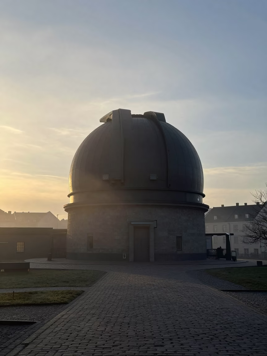 Observatory Dome Silhouette Above Drifting Ground Fog at Sunrise in Copenhagen Denmark in in Copenhagen, Denmark