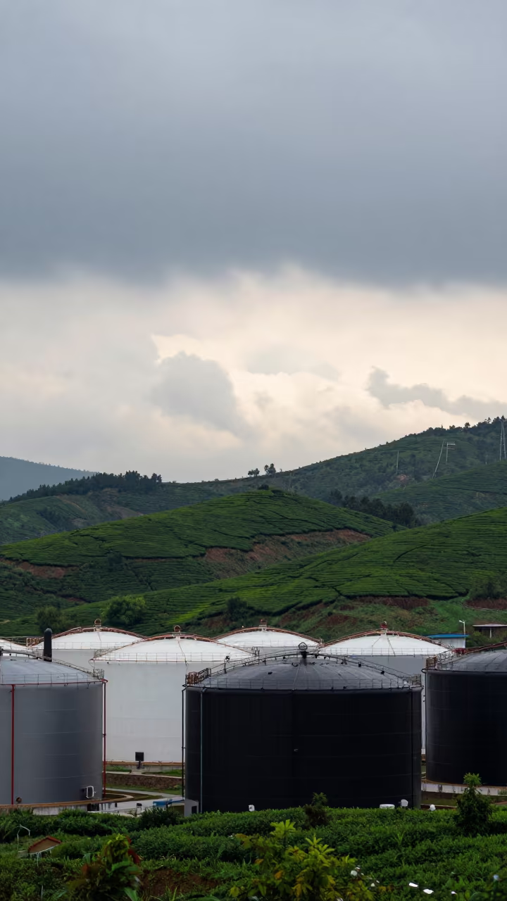 Oil Tanks Silhouetted Against Overcast Ohrid Sky in at the edge of a tea plantation near Ohrid