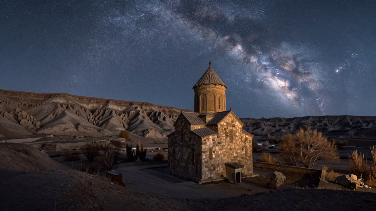 Old Stone Church Under Milky Way Desert Valley in beneath a wind-cut desert escarpment near Bishkek