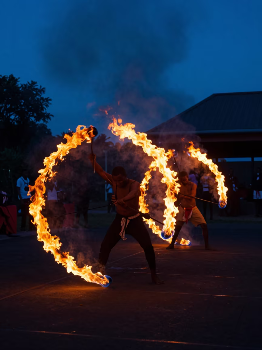 Orange Fire Dances on Dark Stage in Garoua in on a dimly lit stage in Garoua