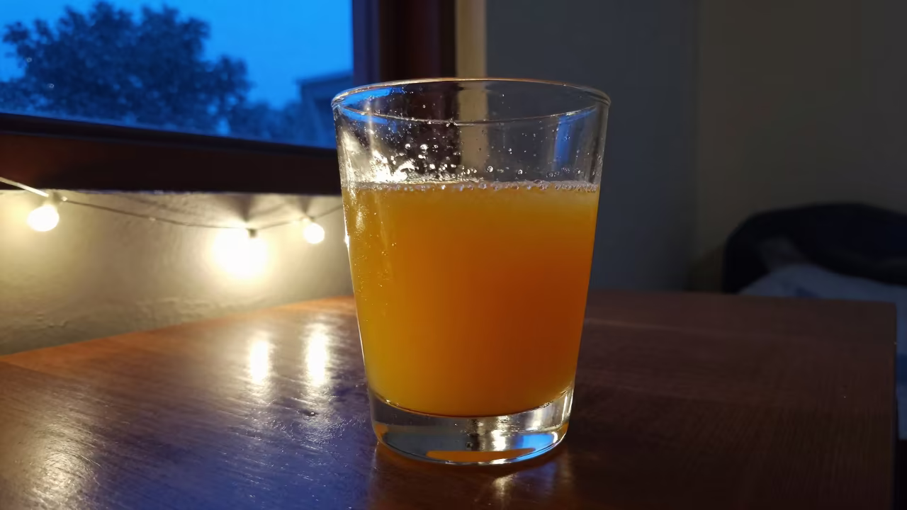 Orange Juice Glass Blue Hour Thanjavur in on a bedside table in Thanjavur