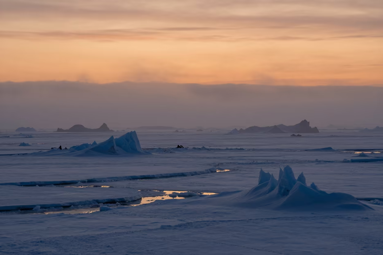 Orange Polar Sunset Over Russian Pack Ice Mist in in Russia