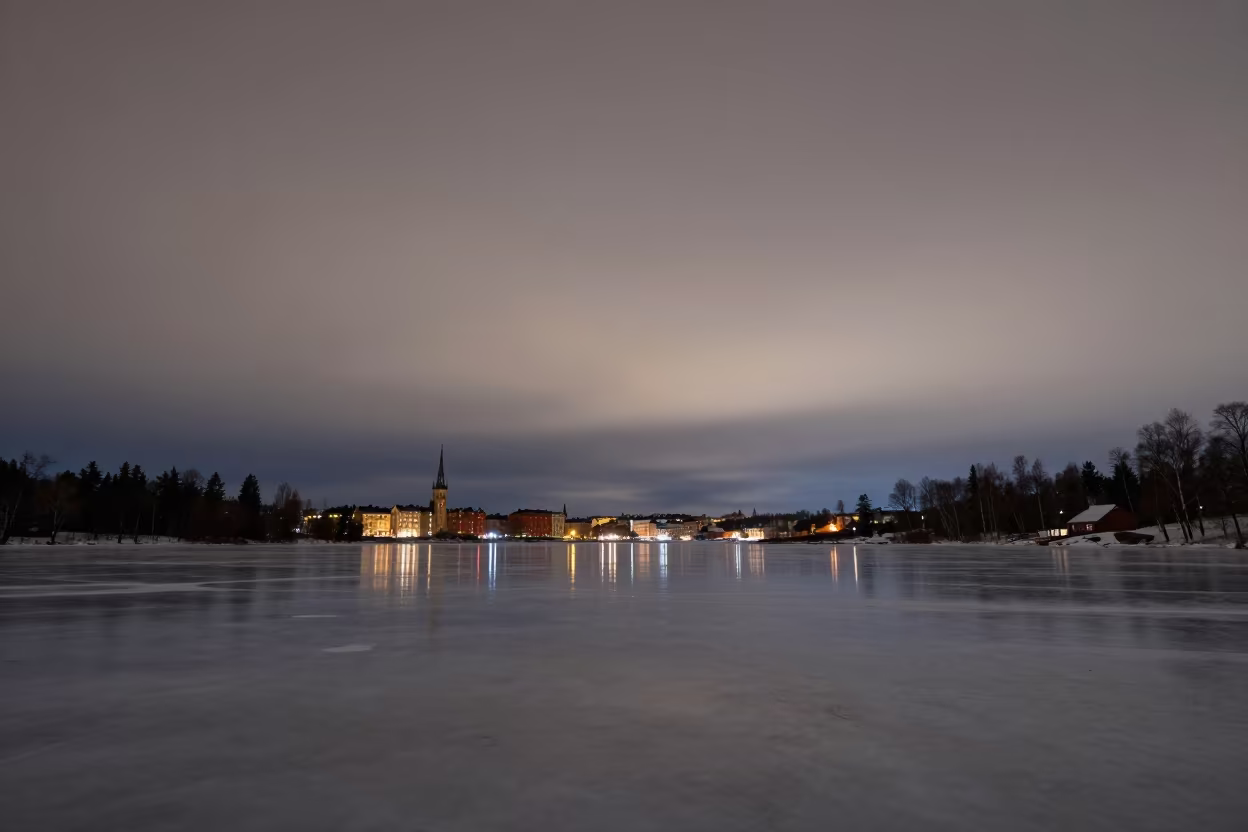 Orion Low Over Frozen Lake Before Dawn in from a frost-hushed ridgeline near Kungsholmen, Stockholm